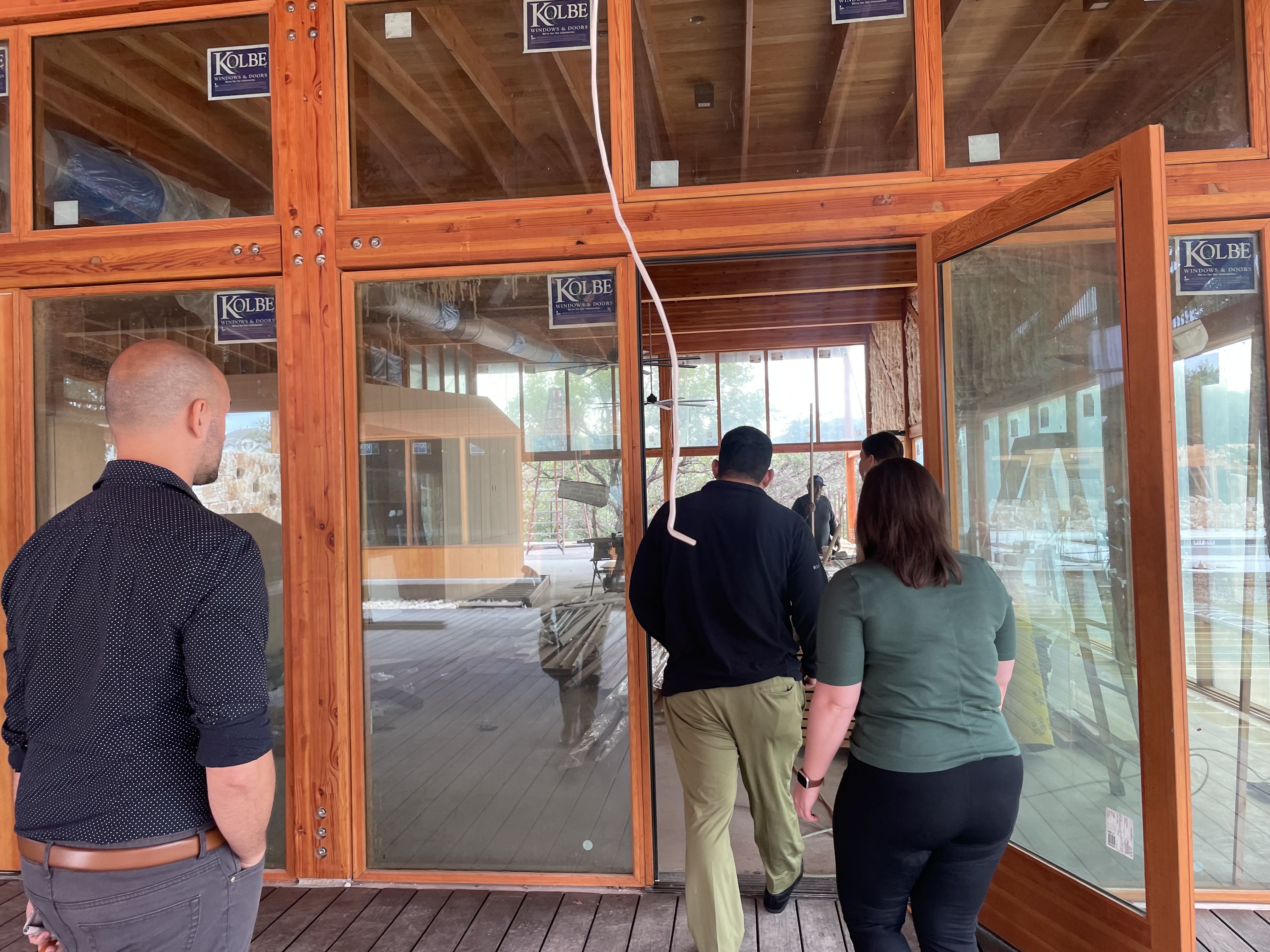 The STI team touring a marketing client's new building in the midst of construction 